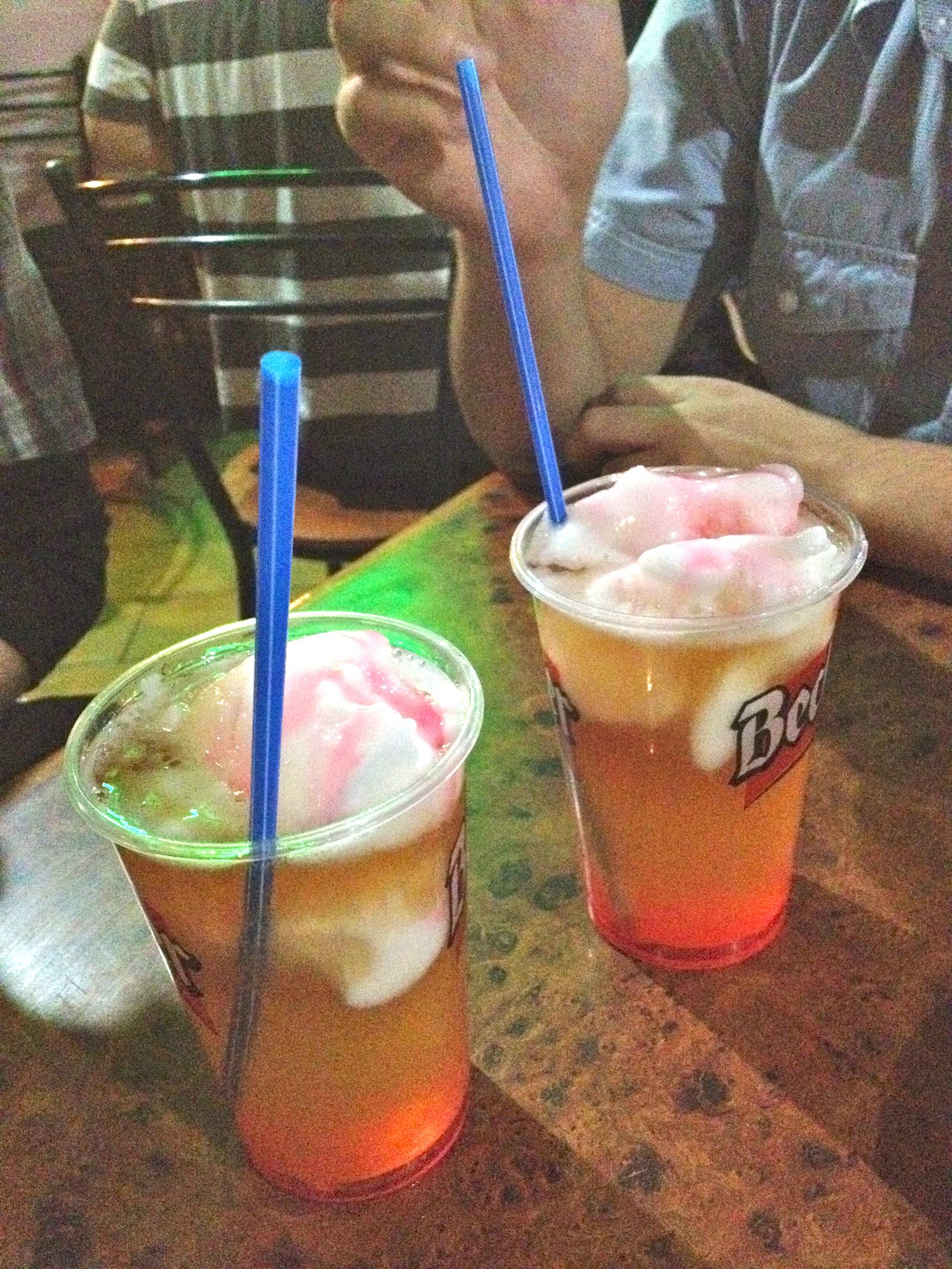 Two terremoto drinks topped with pineapple ice cream